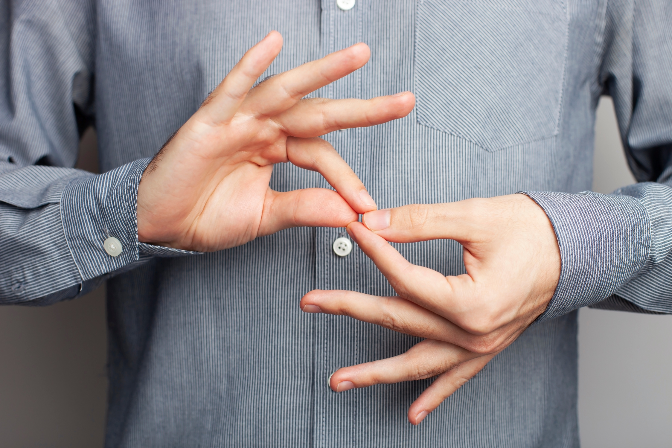 Man showing word INTERPRETER, closeup view. American Sign Language. ASL concept